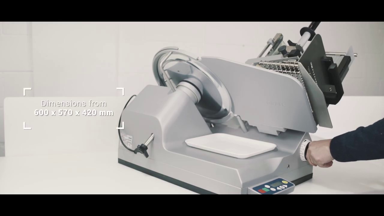 Meat slicer with dimensions of 600 x 570 x 420 mm, gray color, white tray.