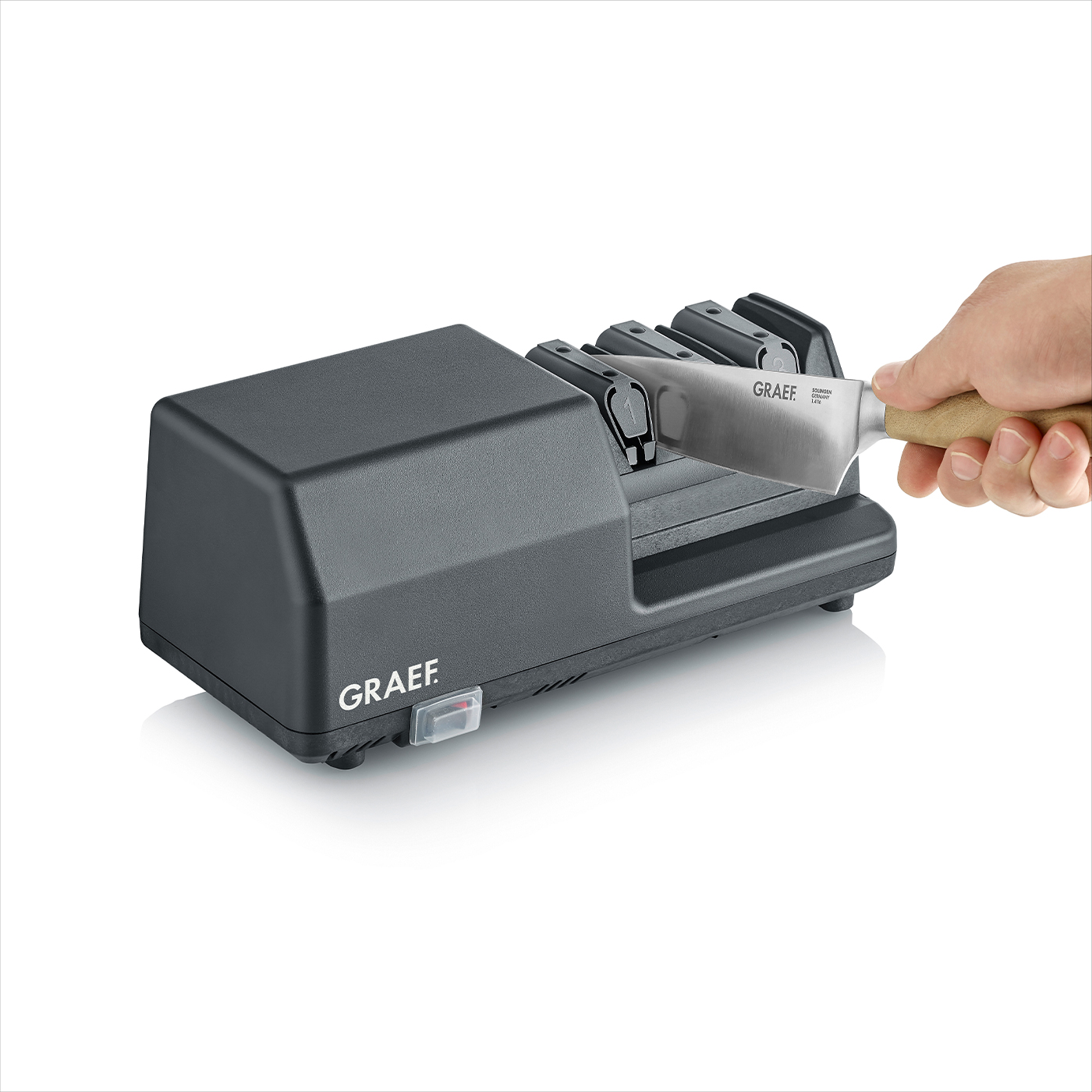 Graef Messerschärfer mit Messer. Schärfen von Messern. Küchenutensilien. Grau.