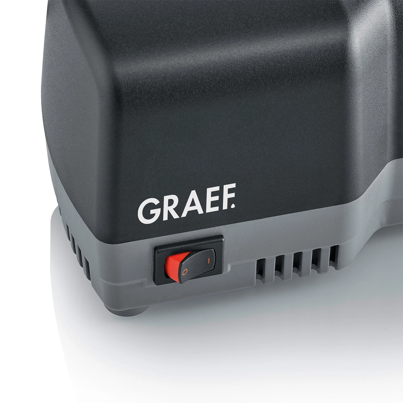 Graef-Gerät mit rotem Schalter und Logo auf grauem Hintergrund