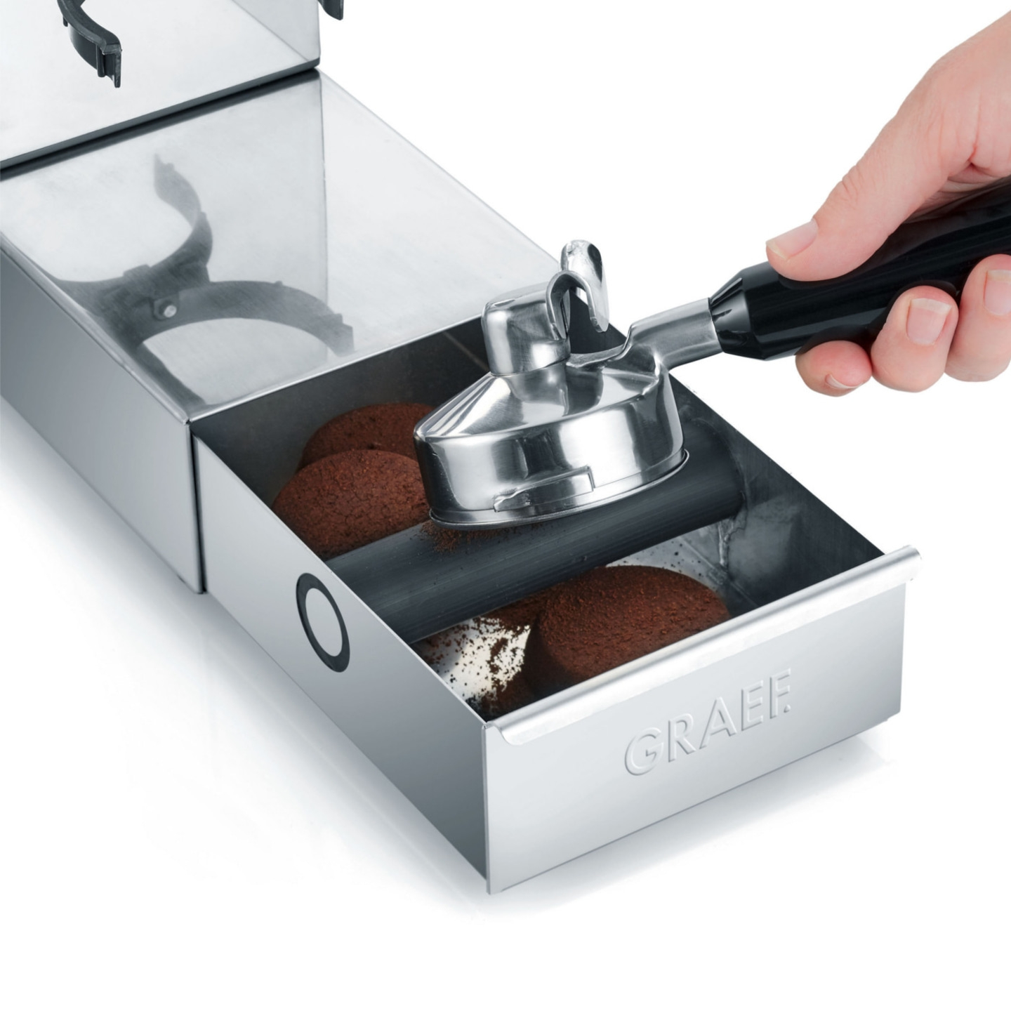 Coffee machine with drawer and hand holding a portafilter, GRAEF logo visible