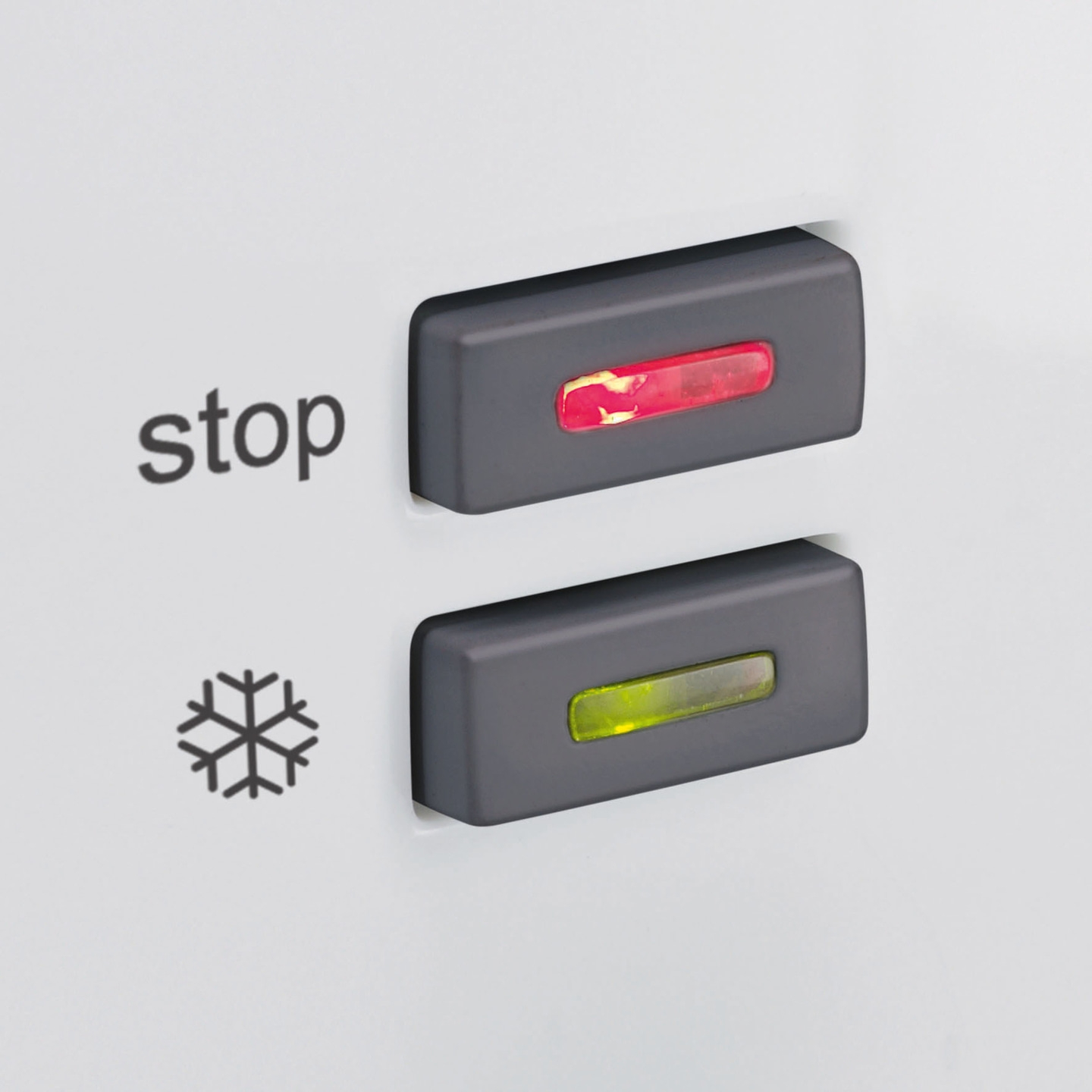 Refrigerator control panel with red and green indicators, stop and snowflake symbol