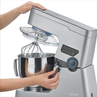 Close-up of a Graef kitchen machine with attachments and controls