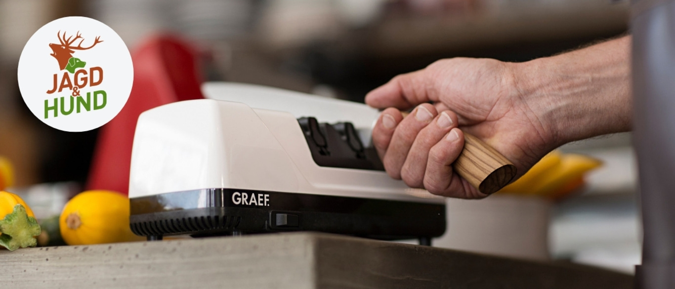 Messer-Schärfer mit Hand, Logo, Jagd & Hund, weißes Gerät, Holzgriff, Nahaufnahme
