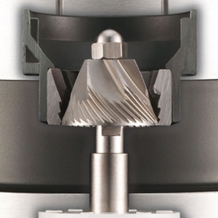 Close-up of a coffee grinder with conical burr and its holder