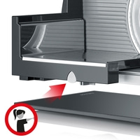 Fleischschneider mit rotem Pfeil und Frauensymbol, um das Tablett zu entfernen.