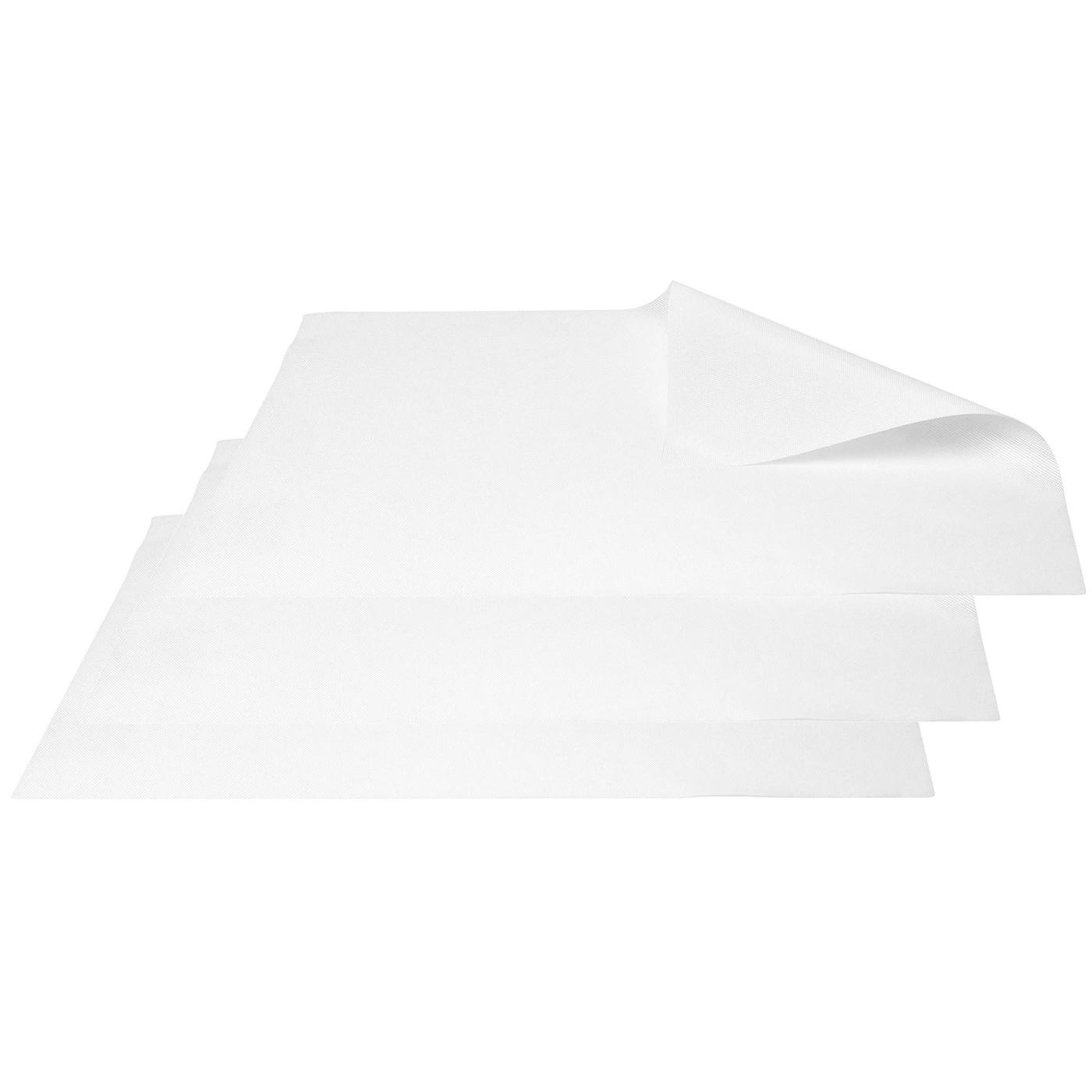 Weiße Papierblätter, die übereinander liegen, mit einer hochgeklappten Ecke