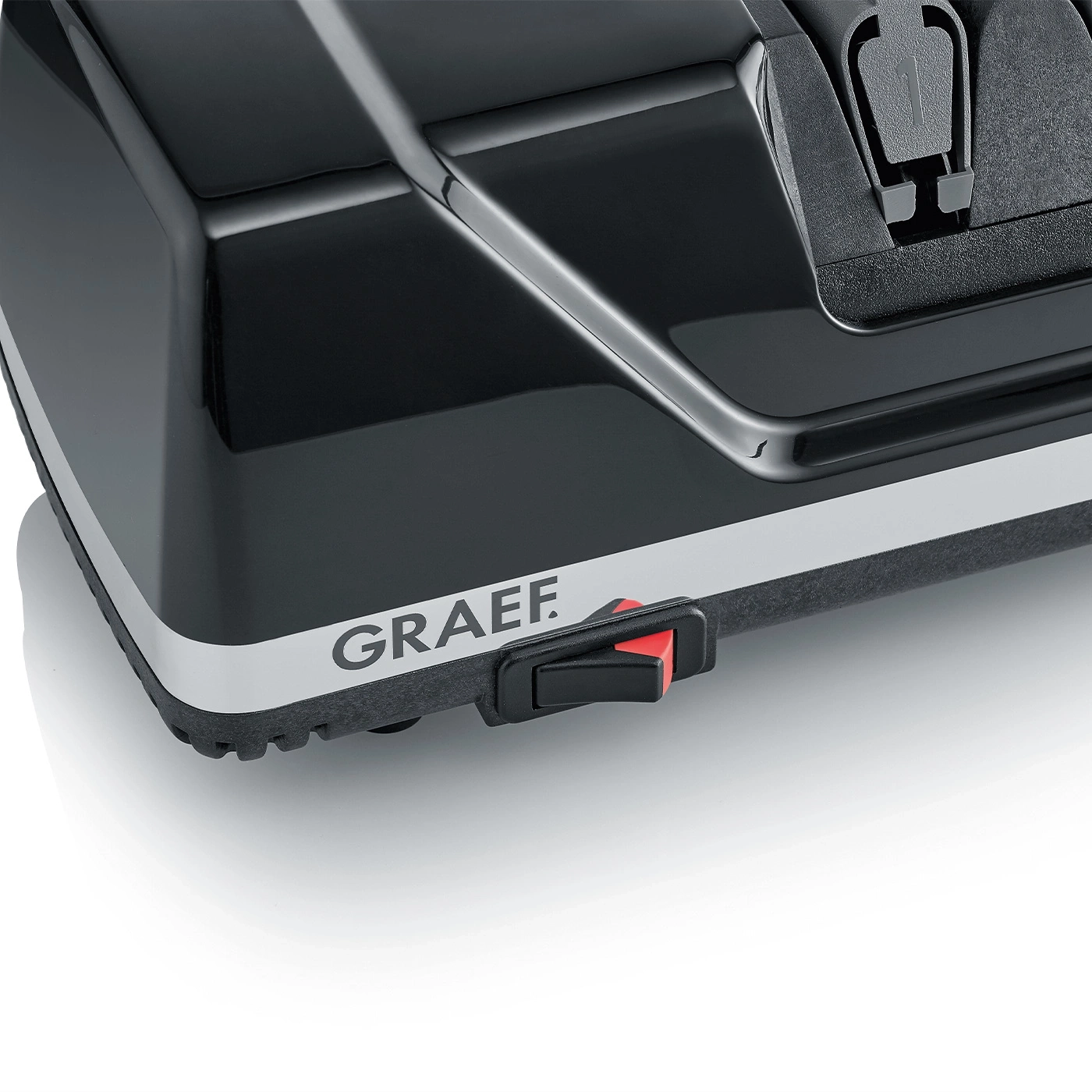 Schwarzes Gerät mit rotem Schalter und GRAEF-Logo auf weißem Hintergrund.