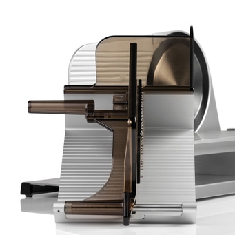 Meat slicer, close-up, transparent plastic part, silver metal, white background