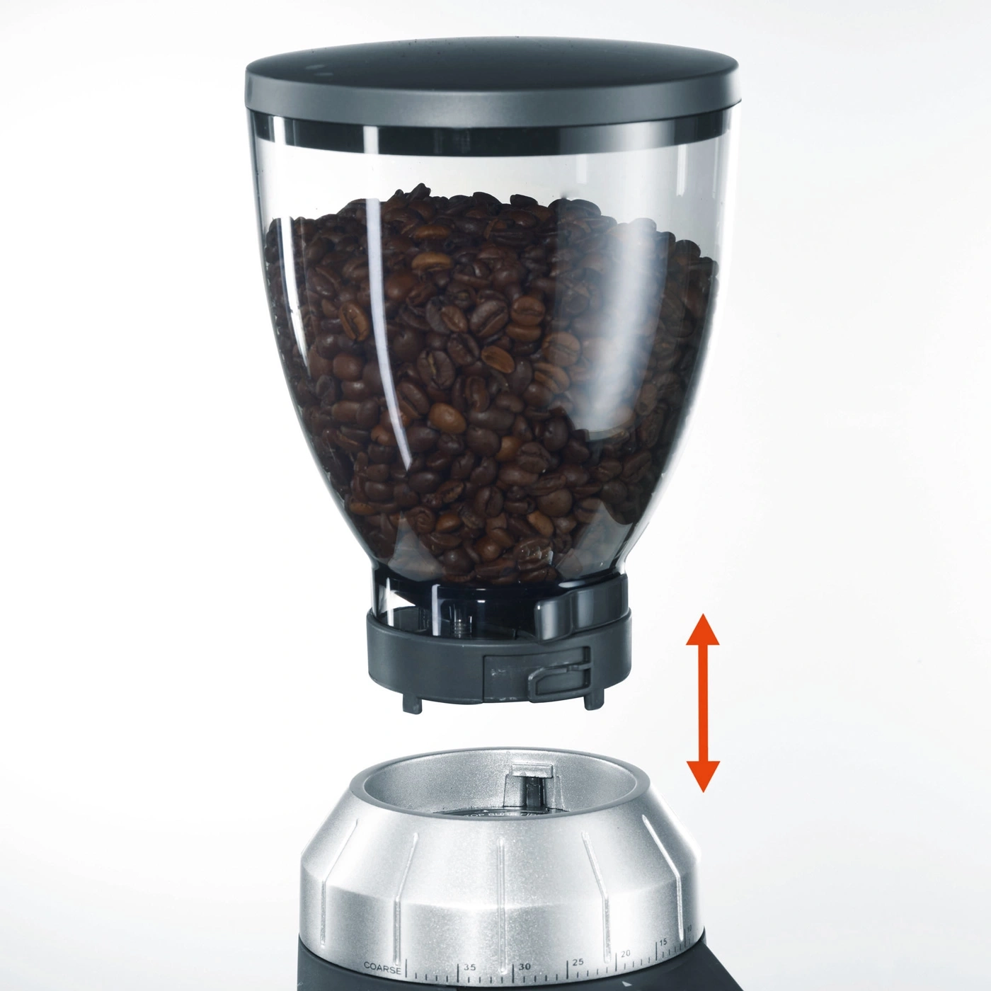 Kaffeemühle mit Bohnenbehälter, Pfeil zeigt die Richtung an.