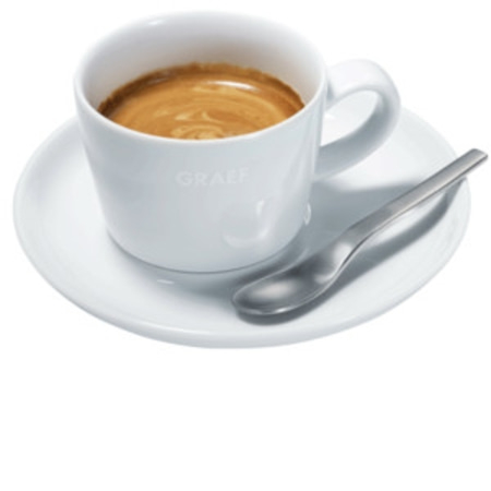 A cup of espresso on a saucer with a spoon beside it.