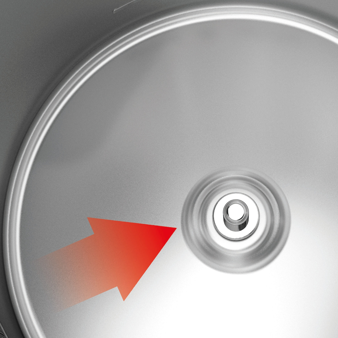 Red arrow pointing towards a silver object with concentric circles.