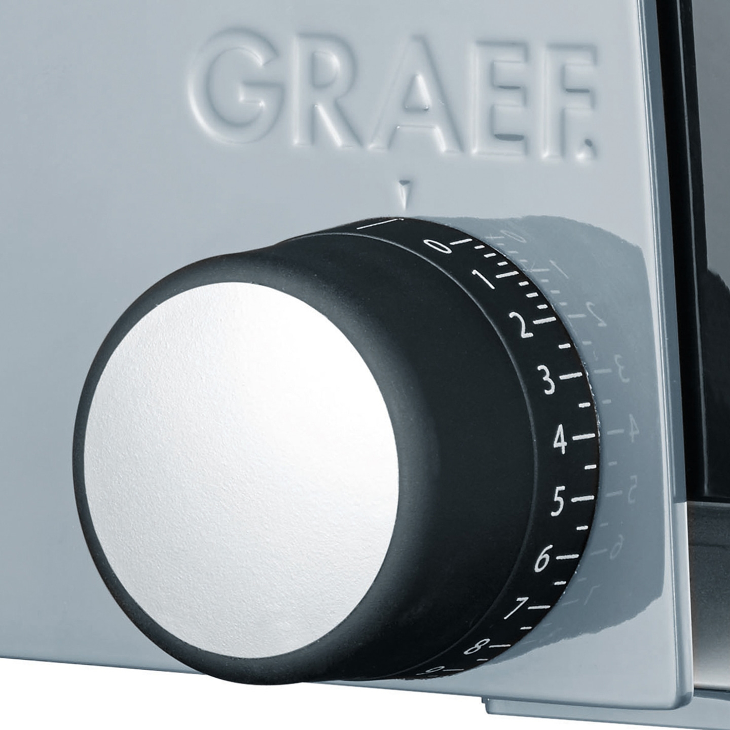 Graef slicer with thickness adjustment dial, black and white, close-up